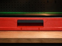 02 — Black PETG replacement handle installed in red PACKOUT drawer front