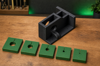 02 — Complete black base jig with five green sizing templates