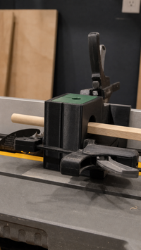 04 — Square wood stock entering the installed dowel jig