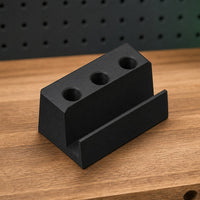 05 — Standalone three-slot Pica holder on a workshop bench