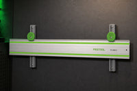 05 — CamDock™ storing one Festool guide rail horizontally on a workshop wall