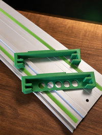 05 — StackTrack™ two green PETG holder parts on Festool guide rail
