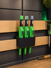 07 — Straight-on installed view of Pica holder with three demonstration tools