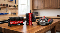 PackDock M18 battery holder workshop product scene with demo tools and batteries