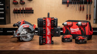PackDock M18 battery holder workshop product scene with demo tools and batteries